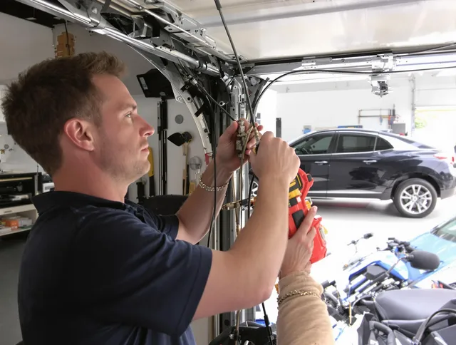Mint Hill Garage Door Repair safety certified technician performing cable replacement in Mint Hill