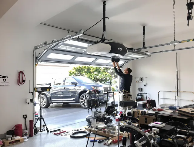 Mint Hill Garage Door Repair specialist installing smart garage door opener system in Mint Hill home