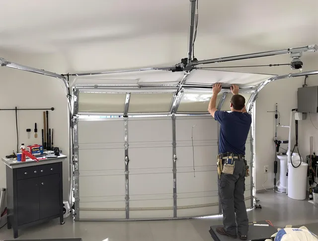 Mint Hill Garage Door Repair specialist performing precise section replacement on Mint Hill garage door